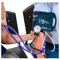 A healthcare professional measuring a patient's blood pressure using a cuff and stethoscope.