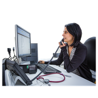 Woman in a medical office on the phone while looking at a computer screen.