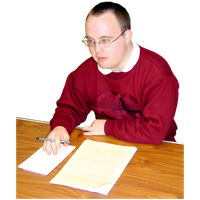 Man in a red sweatshirt writing notes at a table with a pen and paper.