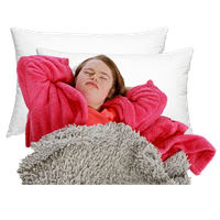 Person in a pink robe lying on white pillows with a grey blanket.