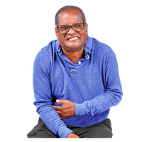 A man in a blue shirt and glasses clutching his stomach in discomfort.