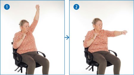 A woman doing seated arm punches