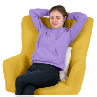 A young person relaxing in a yellow armchair with a lavender hoodie.
